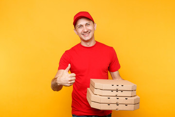 Wall Mural - Delivery man in red cap, t-shirt giving food order pizza boxes isolated on yellow background. Male employee pizzaman or courier in uniform holding italian pizza in cardboard flatbox. Service concept.