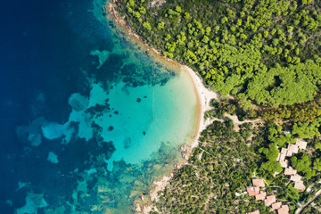 Canvas Print - Spectacular aerial view of a beautiful wild beach bathed by a clear and turquoise sea, Sardinia, Italy.