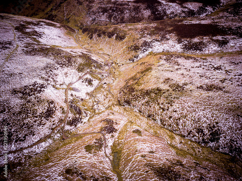 Fotografia Aerial view looking across a valley on mountain range in the UK