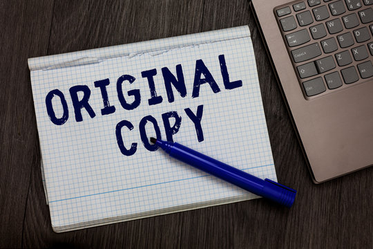 Conceptual hand writing showing Original Copy. Business photo text Main Script Unprinted Branded Patented Master List Open notebook squared page black marker computer wooden background