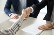 © fizkes - Close up of male recruiter shaking hand of female job applicant greeting with successful interview, HR handshake woman candidate congratulating with employment, thanking or welcoming at work