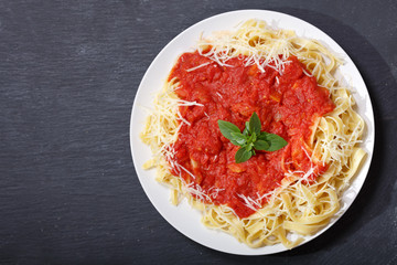 Canvas Print - plate of pasta with tomato sauce, top view