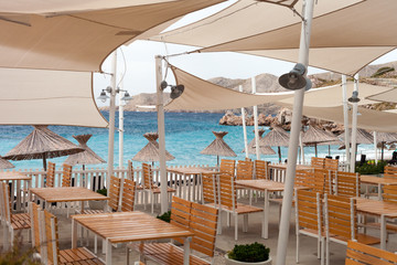 Wall Mural - Empty restaurant on beach before or after tourist season