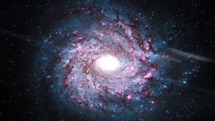 Spiral galaxy rotating in outer space on star field flare light at center. Contains public domain image by NASA