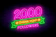 2000 followers neon sign on the wall.