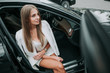 © Yakobchuk Olena - Top view portrait of cheerful young businesswoman having leisure in cozy vehicle. Glad girl during relax in automobile concept
