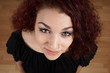 © Axel Bueckert - wide high angle view of beautiful young woman looking up at camera