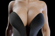 © PixlMakr - Large breasted woman in a black dress with deep neckline and huge cleavage