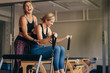 Women having fun while doing pilates workout