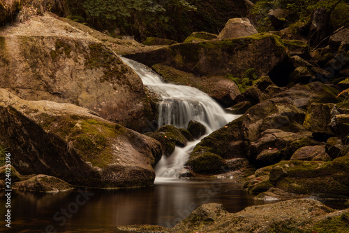 Mountain Water River With Waterfalls Over Rocks And Tree