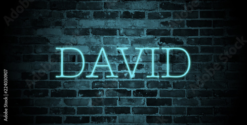 Fotografía first name David in blue neon on brick wall