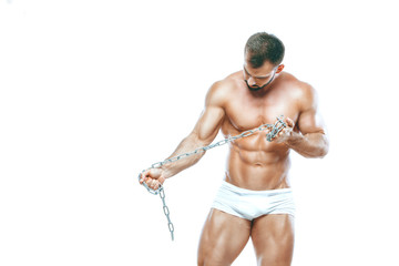 Wall Mural - bodybuilder posing. Beautiful sporty guy male power. Fitness muscled manin white lingerie. on isolated white background. Posing with chain