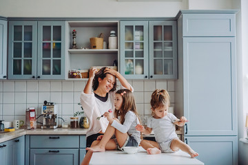 happy family having fun in the kitchen