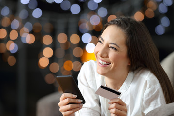 Poster - Pensive online shopper holding a credit card