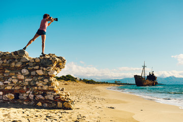 Wall Mural - Tourist take photo on beach sea shore