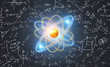 © ImageFlow - Gold and blue atom model and formulas blackboard