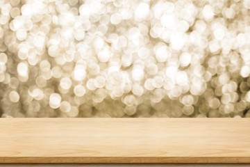 Fototapete - Empty old rustic wood table top with blur sparkling gold bokeh abstract background,panoramic banner for display or montage of product,Holiday seasonal concept backdrop.