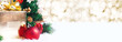 gift box and ball decoration under christmas tree on white fer with gold bokeh light background with snow fall.banner mock up for display of design or content.