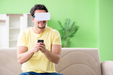 Young man with virtual reality goggles