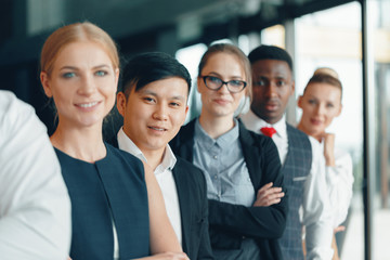 Wall Mural - Successful team of young perspective businesspeople in office