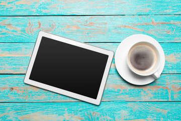 Poster - digital tablet and coffee cup on wooden table