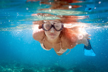 Smiling Woman Snorkeling In Clear Water, Underwater Tropical Sea