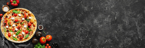 Cuadros en Lienzo Italian pizza and pizza cooking ingredients on black concrete background