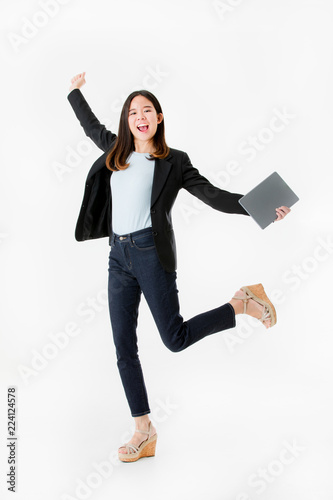 Photographie Asian businesswoman in black suit joyful jumping with celebrating successful isolated on white background studio shot