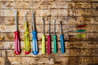 Colorful screwdrivers on a wooden table