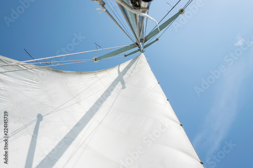 Fotografie, Obraz White sail of a sailing boat against sky