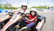 © Tom Wang - father and daughter driving go kart on the track
