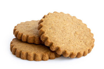 Poster - A pile of three round gingerbread biscuits isolated on white. Serrated edge.