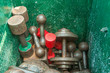 Old rusty weights in a green metal box