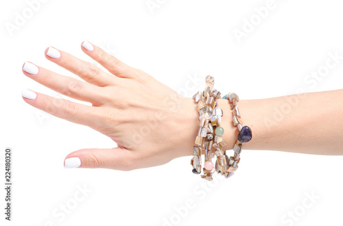 Fotomural Beads stones bracelet in hand on a white background isolation