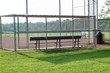 A view from behind the dugout bench at the ball field.