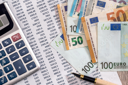 Euro Banknotes With Calculator And Pen On Bank Account Statement Euro Banknotes With Calculator And Pen On Bank Account Statement
