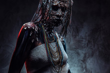 Portrait Of A Scary African Shaman Female With A Petrified Cracked Skin And Dreadlocks. Make-up Concept.