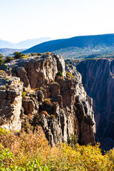 Wall Mural - Steep, sheer cliffs and colorful fall foliage in early morning light characterize Black Canyon of the Gunnison National Park in Colorado