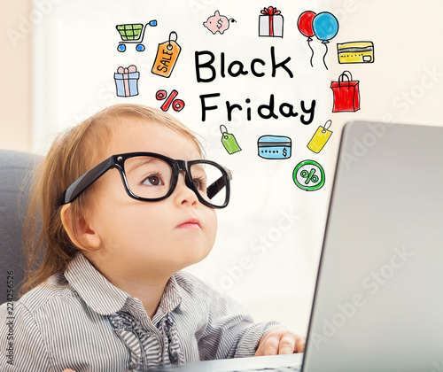 Foto Black Friday text with toddler girl using her laptop