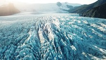 aerial view of glacier in Iceland, beautiful nature landscape, flying over blue ice in mountains