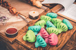 Colorful And Bright Dumplings On Wooden Serving Board With Tomato and Sour Cream Sauces, Onions, Grilled Meat On Skewers. Traditional Asian Cuisine. Concept Of Beautiful, Appetizing And Healthy Food.