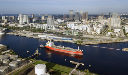 Wall Mural - Little Tug Boats Do Double Duty Hauling Transport Ships in Port at Tampa