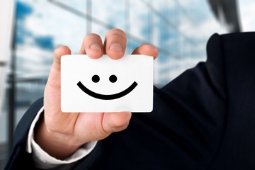 Businessman shows his business card, white empty