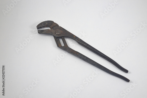 Fotografija  Old used pliers on white background