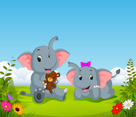 Poster - the natural view with the two elephant playing the doll in the yard 
