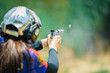 The woman's hands are practicing firing guns and shelling out.