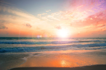 Wall Mural - trust concept: child on the beach looking on the sea sunset