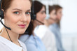 © rogerphoto - Call center. Beautiful cheerful smiling operator consulting clients with headset. Business concept of customer service