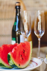 Two slices of red watermelon on white plate