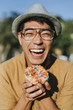 © Rawpixel.com - Happy man having a doughnut